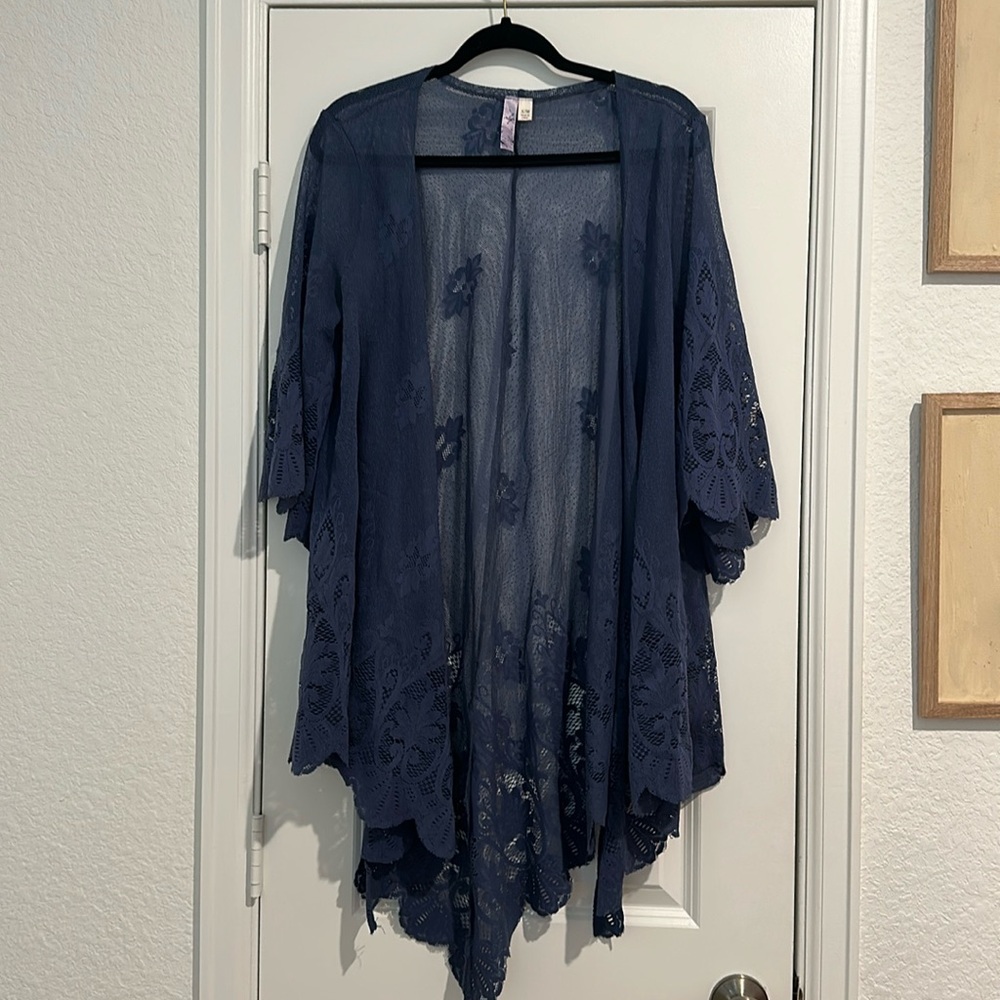 a blue see through cardigan